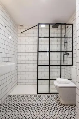 a white bathroom with a toilet and a shower at New Flat center historic Ruzafa Wifi AC in Valencia