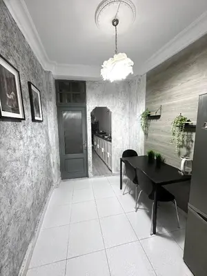 a dining room with a black table and a dining roomiasm at La montaña del sol in Sueca