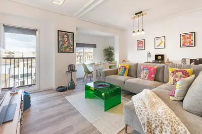 a living room with a couch and a table at Valencia Designer Apartment next to metro in Paterna