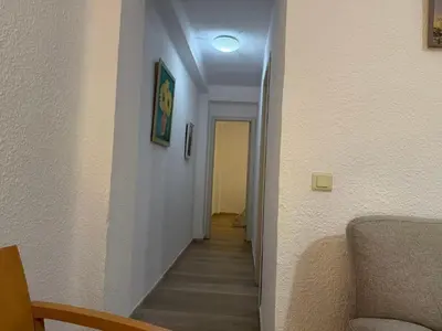 a hallway with a stairway leading into a room at Precioso piso acerca de Estación Joaquín Sorolla in Valencia