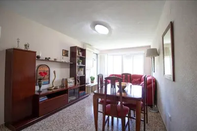 a living room with a dining room table and a living room at Casa con vistas al rio in Navajas