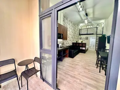 a room with a table and chairs and a dining room at Ciudades de España in Valencia