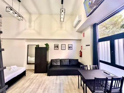 a living room with a couch and a table at Ciudades de España in Valencia