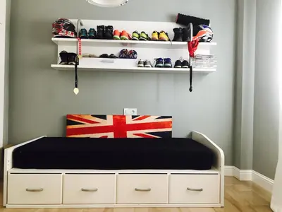 a bedroom with a bed and shelves with shoes at Cuco in Requena
