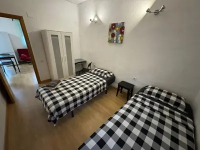 two beds sitting next to each other in a room at Padre Antonio in Valencia