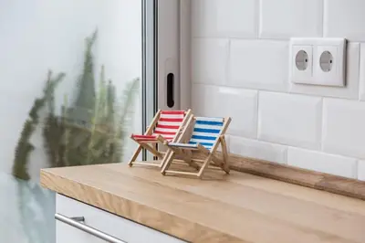 a bedroom with a yellow bed and a chair at House near beach w-terrace in Valencia