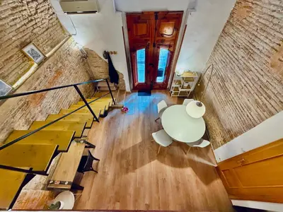 an overhead view of a room with a table and stairs at Duplex en el Carmen in Valencia