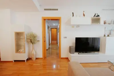 a living room with a television and a couch at Family & Friends Apartment with Pool in Torrent