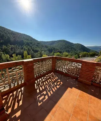 a balcony with a view of the mountains at Villa punta RJ in Pavías