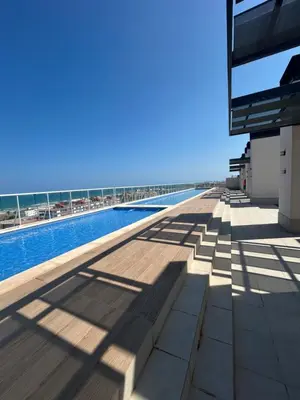 a view of the pool on the roof of a building at Canet al Mar Luxe y Confort-Pet Friendly in Canet de Berenguer