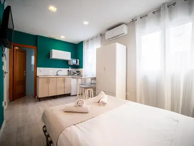 a bedroom with a large bed with towels on it at Apartment Ruzafa Market 8A in Valencia