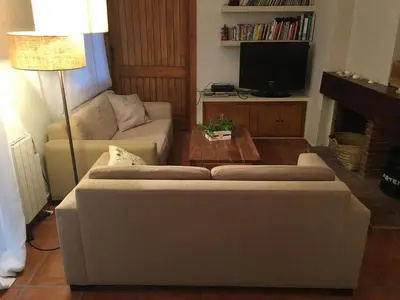 a living room with a couch and a coffee table at Ideal apartment in Náquera, Pool, Wifi in Náquera