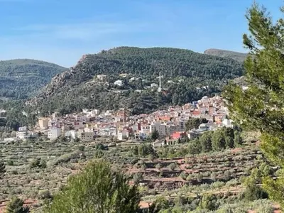 a town on top of a hill with houses at Gatova Sunset Retreat in Gátova
