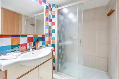a bathroom with a sink and a shower at Gatova Sunset Retreat in Gátova
