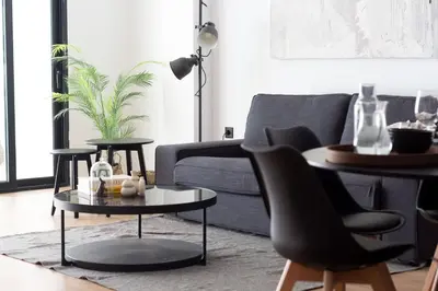 a living room with a couch and a table and chairs at Valencia Leones by Concept Flats in Valencia