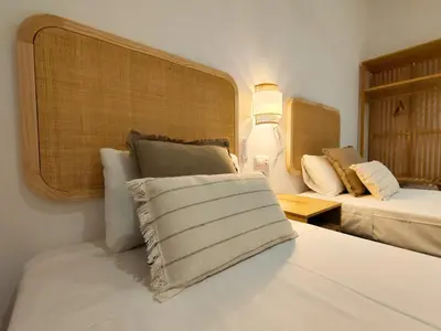 a hotel room with two beds and a window at Travel Habitat Jesus-Patraix Familiar Apartment in Valencia