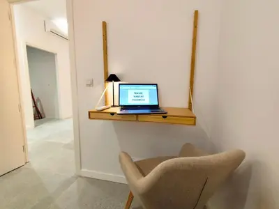 a laptop computer sitting on a shelf on a wall at Travel Habitat Jesus-Patraix Familiar Apartment in Valencia