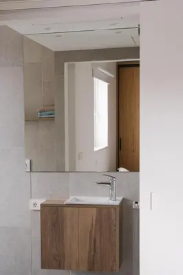 a bathroom with a sink and a mirror at Burriana X - Estudio in Valencia