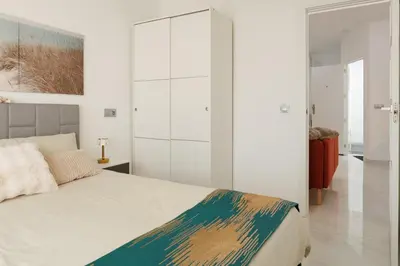 a bedroom with a bed and a glass wall at Top Floor 2 Bedroom Apartment with Terrace in Valencia