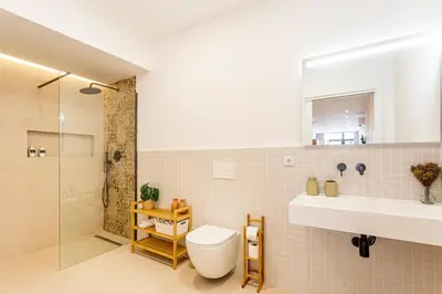 a bathroom with a toilet and a sink and a shower at B - Design apartment at El Grao close to the beach in Valencia