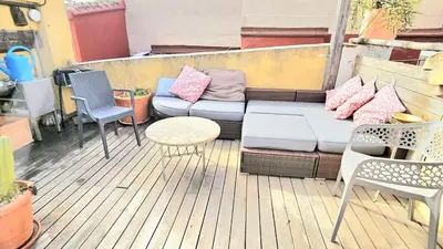 a couch on a deck with chairs and a table at Ático Exclusivo del Siglo XVI con Dos Terrazas en el Corazón de Ciutat Vella in Valencia