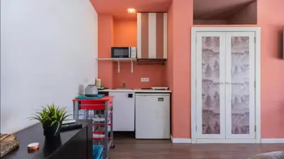 a kitchen with a white refrigerator and a white dishwasher at Tu Estudio En El Centro-Ruzafa 10C in Valencia