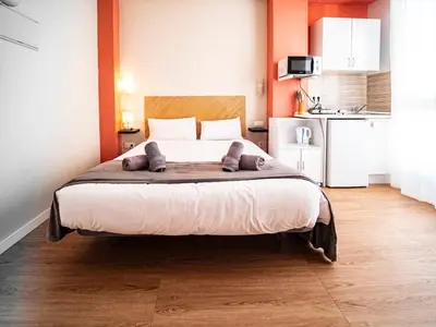 a bedroom with a large bed with two pillows on it at Estudio En El Centro-Ruzafa 10D in Valencia