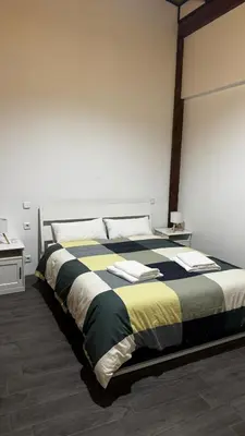 a large bed in a room with at Plaza la REINA 3th floor & no elevator in Valencia