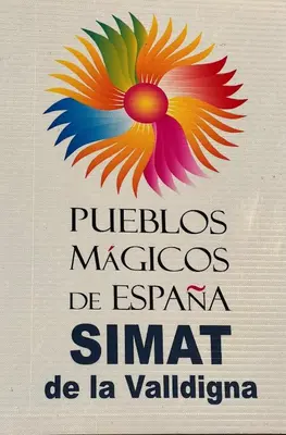 a sign with a colorful flower on it at Restored house near Valencia in Simat de Valldigna