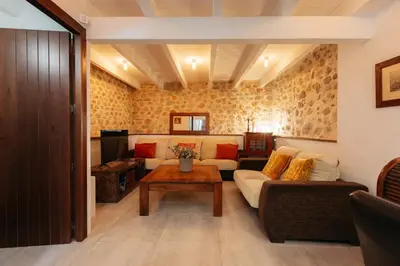 a living room with a couch and a table at Brisas Chulilla Boutique Apartment in Chulilla