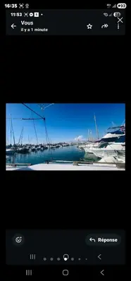 a television screen with a picture of a harbor at La Pepa in Valencia