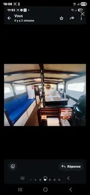 a screenshot of a tv screen with a couch in a van at La Pepa in Valencia