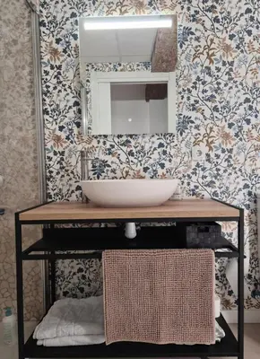 a bathroom with a sink and a mirror at Valencia Catedral Apt in Valencia