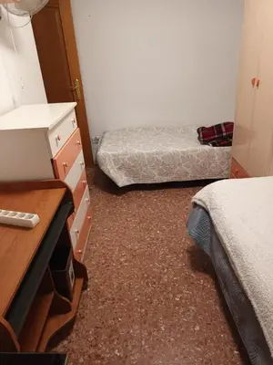a bedroom with two beds and a dresser and a dresser at Habitación doble 45eur in Valencia