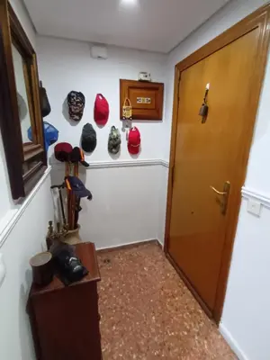 a room with a door and some hats on the wall at Habitación doble 45eur in Valencia