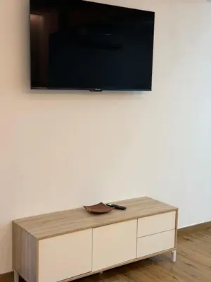 a tv on top of a white wall at Apartamento junto a la playa in Valencia