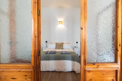 a bedroom with a bed in a room at Prime Location, Bright & Cozy Apartment in Valencia