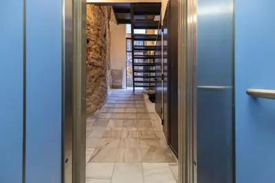 a corridor of a wine cellar with wooden floors at Prime Location, Bright & Cozy Apartment in Valencia