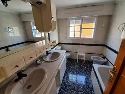 a bathroom with two sinks and two toilets at House Mare Nostrum in Moncófar