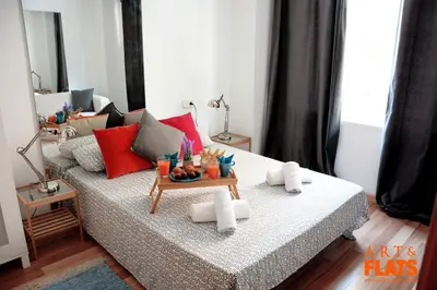 a living room with a couch and a table at ART & FLATS Pleno Centro Valencia in Valencia