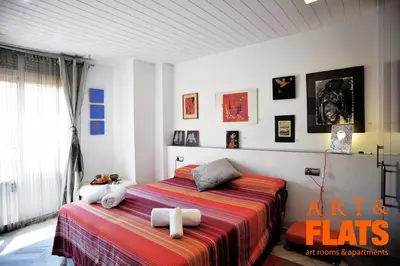 a bedroom with two beds with towels on them at ART & FLATS Pleno Centro Valencia in Valencia