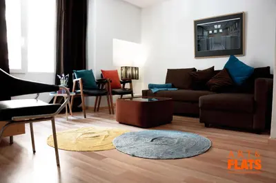 a living room with a couch and chairs at ART & FLATS Pleno Centro Valencia in Valencia