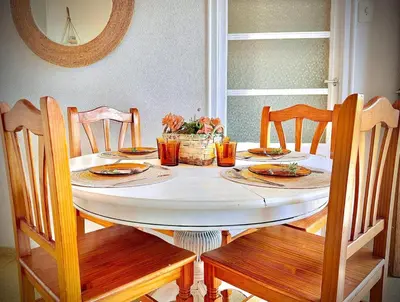 a table with plates of food on top of it at El Cortijo a cielo abierto entre montañas in Estivella