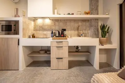 a kitchen with a sink and a microwave at Suite con terraza - Manolito 1 in Valencia