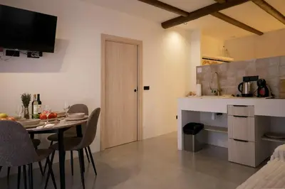 a kitchen and dining room with a table and chairs at Eco suite Puerto - Manolito 3 in Valencia