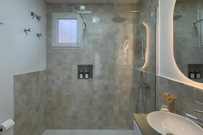 a bathroom with a shower and a sink at Casa La Pedrera in Pedralba