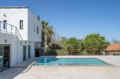 a swimming pool in the backyard of a house at White House with MINIGOLF 10 minutes from Cullera in Corbera de Alcira