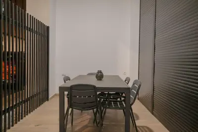 a dining room with a table and some chairs at Comfortabel Apartment next to La Marina in Valencia