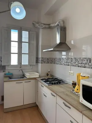 a white room with a table and a window at Urban Stay Valencia - Primado Reig in Valencia