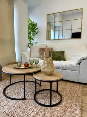 a living room with two tables and a couch at Loft acogedor y luminoso in Valencia